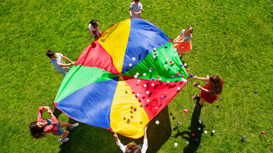 Parachute game to show icebreaker exercises for students