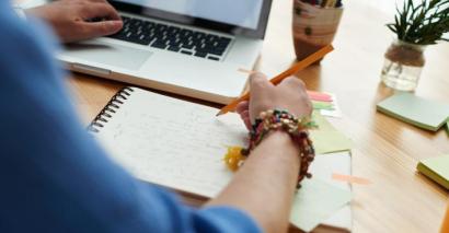 Teacher creating their lesson plan using a lesson planning template