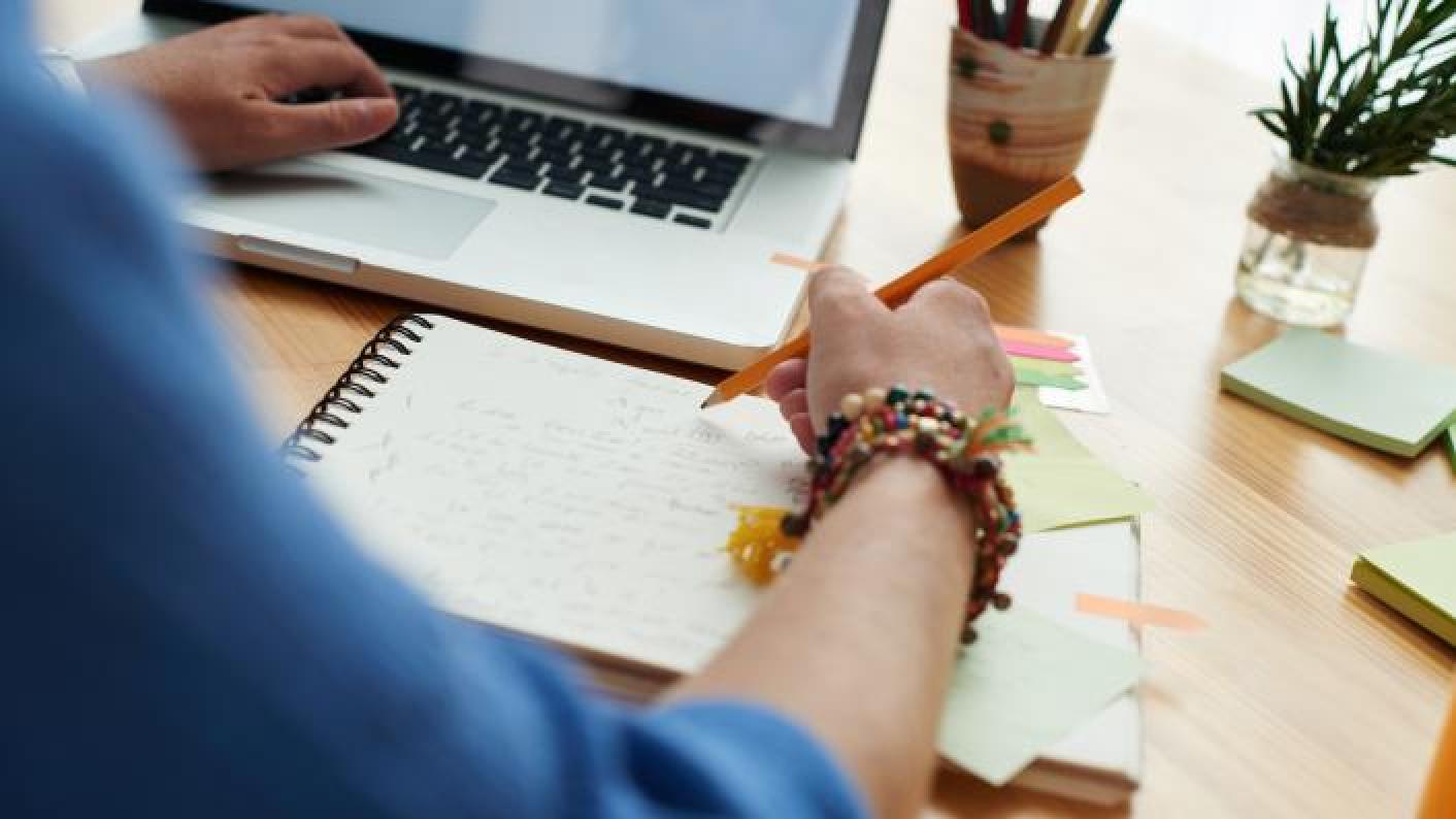 Teacher creating their lesson plan using a lesson planning template
